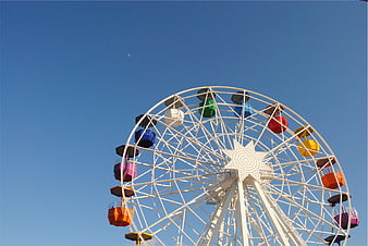 Colorful Ferris Wheel Against Clear Blue Sky