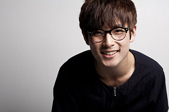 Smiling Young Asian Man Wearing Black Glasses