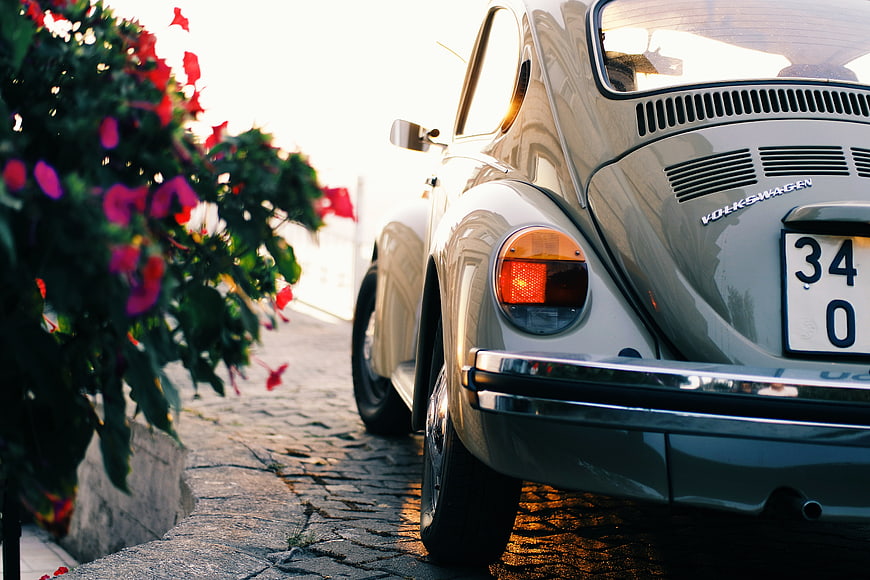 Vintage Volkswagen Beetle Rear View on Cobblestone Street