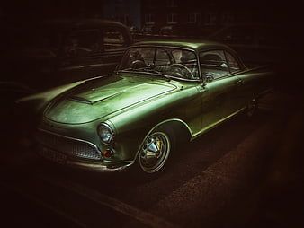Vintage Green Classic Car Parked at Night