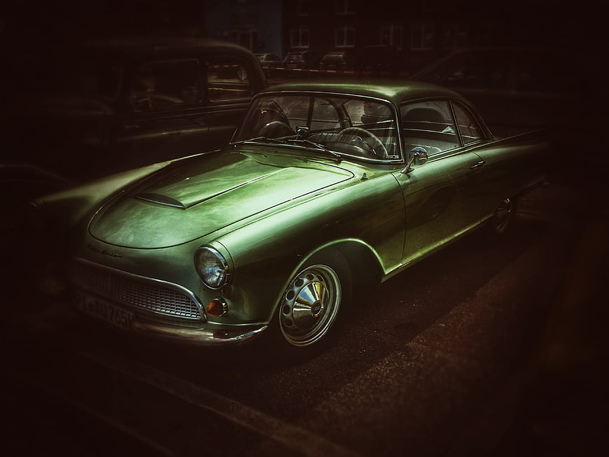 Vintage Green Classic Car Parked at Night
