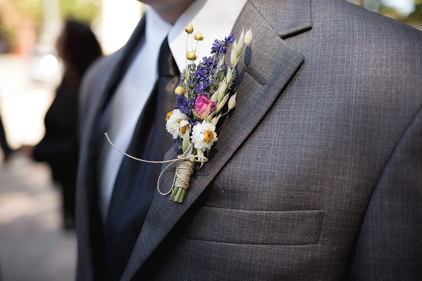 Groom's Gray Suit With Colorful Wildflower Boutonniere Close Up