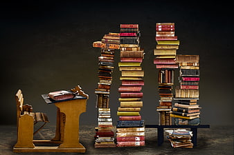 Number 11 made of vintage books with school desk