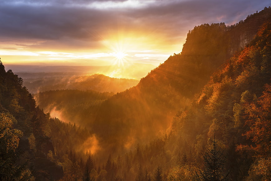 Golden Sunrise Over Misty Mountain Forest Valley