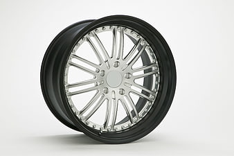 Black and Chrome Car Wheel Rim on White Background