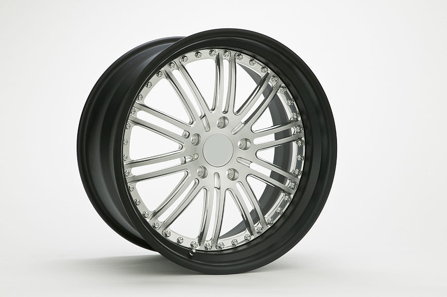 Black and Chrome Car Wheel Rim on White Background