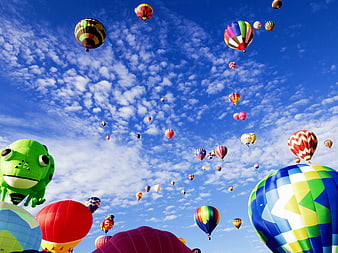 Colorful Hot Air Balloons Flying in Blue Sky with Clouds