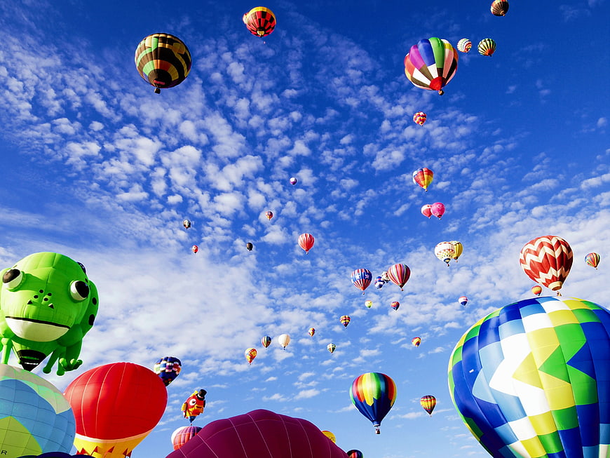 Colorful Hot Air Balloons Flying in Blue Sky with Clouds
