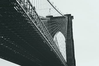 Low angle view of Brooklyn Bridge steel structure and cables