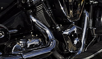Close-up of Chrome Motorcycle Engine and Exhaust Pipes
