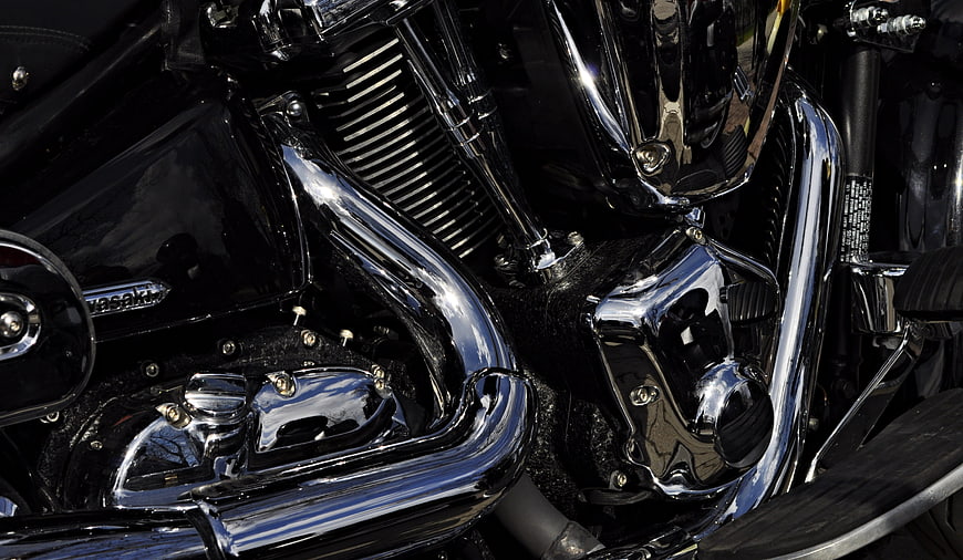 Close-up of Chrome Motorcycle Engine and Exhaust Pipes