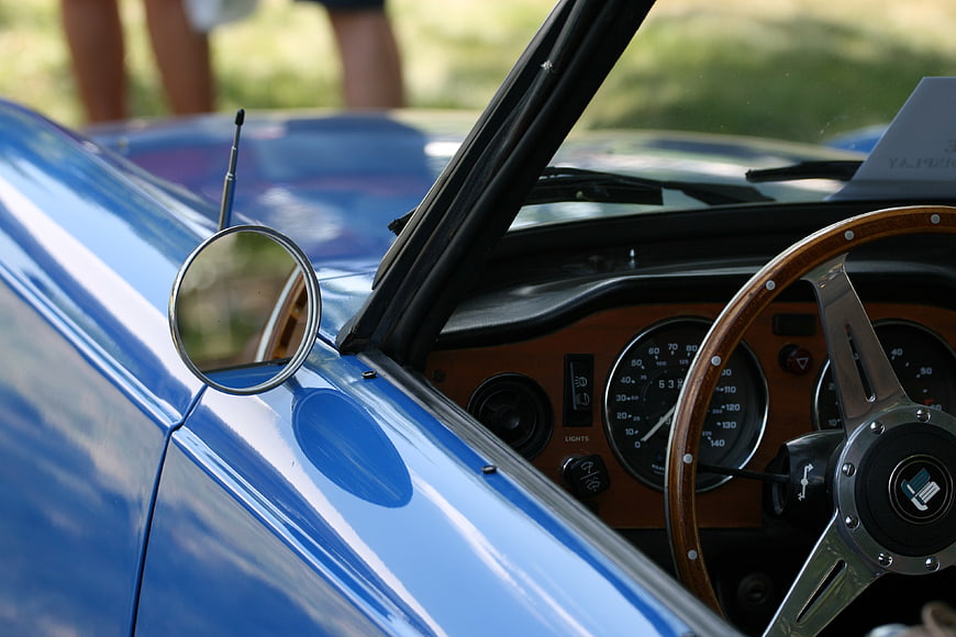 Classic Blue Sports Car Interior with Wood Steering Wheel