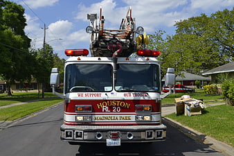 Front View Of Houston Fire Department Ladder Truck In Suburban Neighborhood