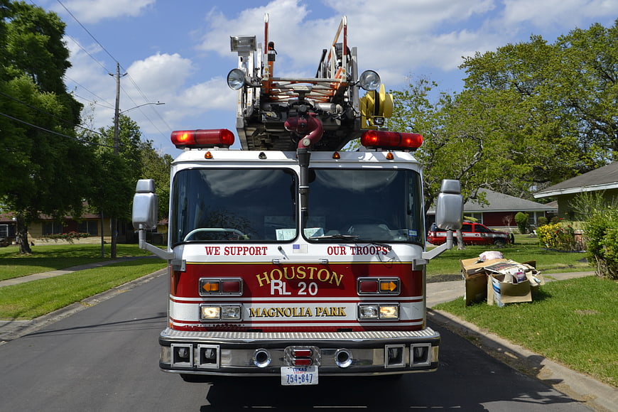 Front View Of Houston Fire Department Ladder Truck In Suburban Neighborhood