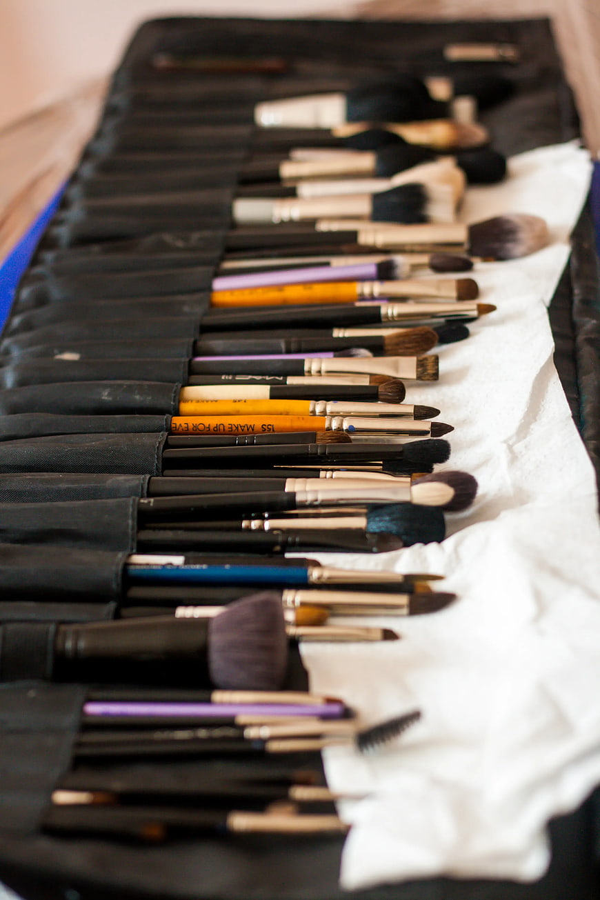 Professional makeup brushes in black roll case