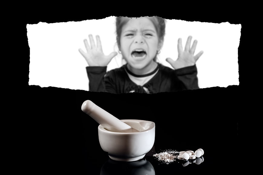Stressed child screaming above mortar and pestle with pills