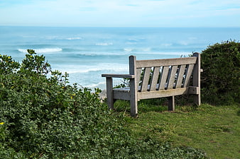 Wooden Bench Facing The Ocean Seaside