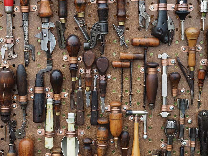 Vintage woodworking tools on pegboard wall