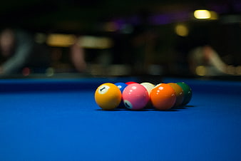 Colorful 9-Ball Rack on Blue Pool Table