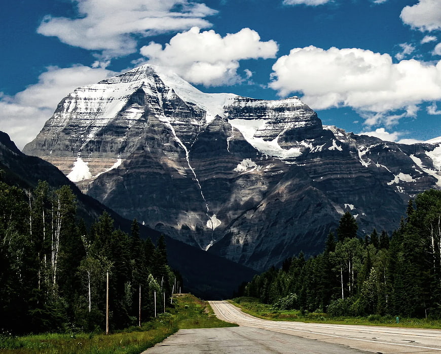 Scenic Road Leading to Snow-Capped Mountain Peak