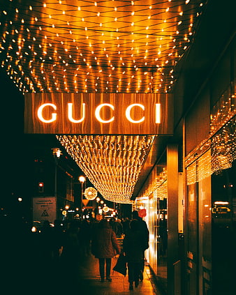Gucci Storefront With Golden String Lights On Berlin Street At Night