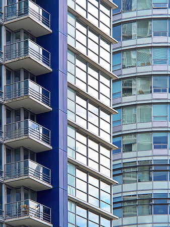 Modern Blue and White Apartment Building Facade with Balconies