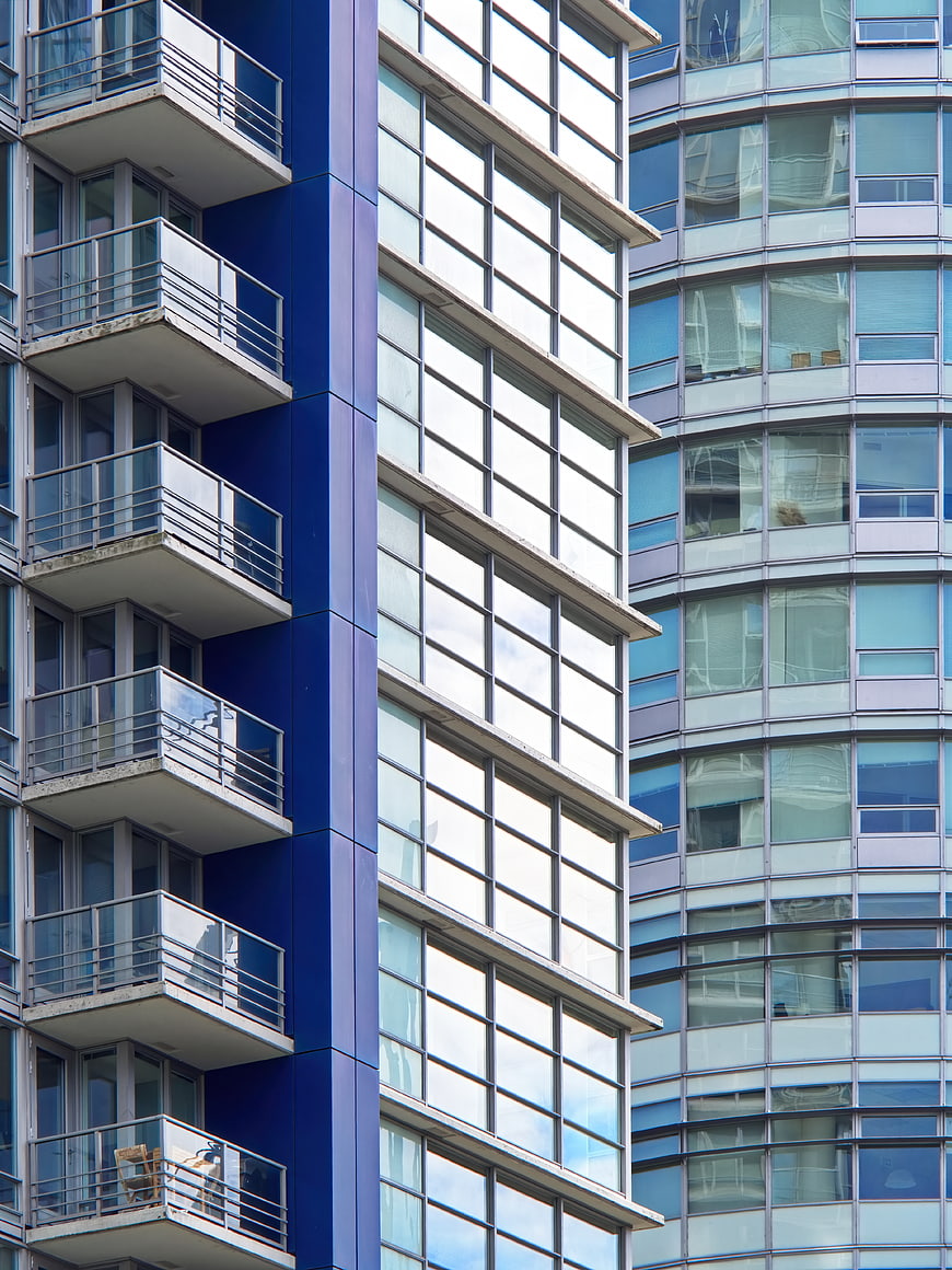 Modern Blue and White Apartment Building Facade with Balconies
