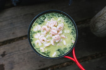Top View of Creamy Shrimp and Spinach Soup in Camping Pot