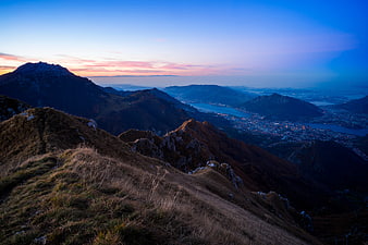 Mountain Ridge at Sunset with City and Lake View