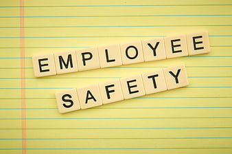 Employee Safety Scrabble Tiles on Yellow Notepad
