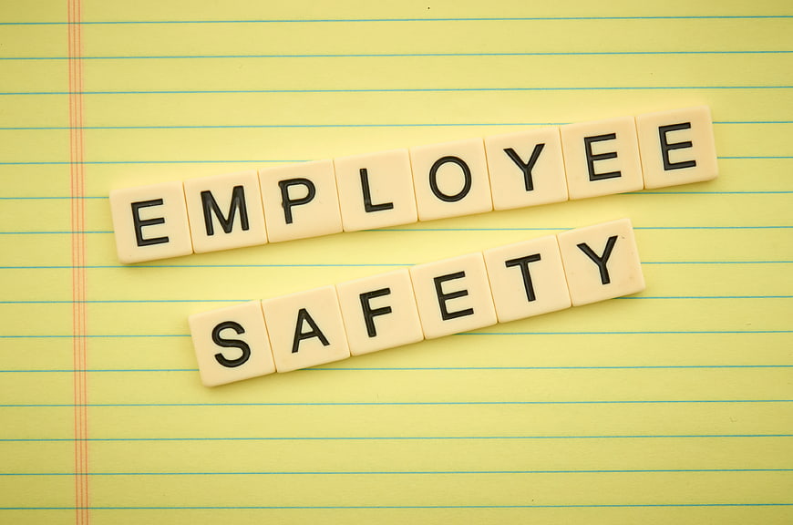 Employee Safety Scrabble Tiles on Yellow Notepad