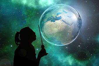 Silhouette of woman holding a soap bubble containing the Earth against a cosmic galaxy background