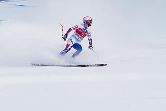 Alpine skier in action during a downhill race