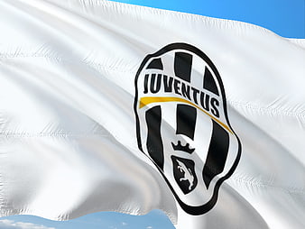 Juventus Football Club Flag Waving Against Blue Sky