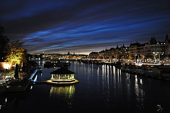 Night View of Floating Restaurant on Harbor Water