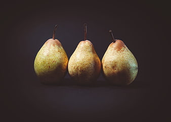 Three Ripe Pears Still Life on Dark Background