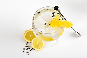 Top View of Refreshing Gin Cocktail with Lemon and Peppercorns
