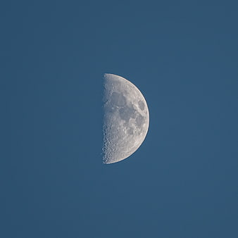Crescent Moon in Blue Sky with Craters