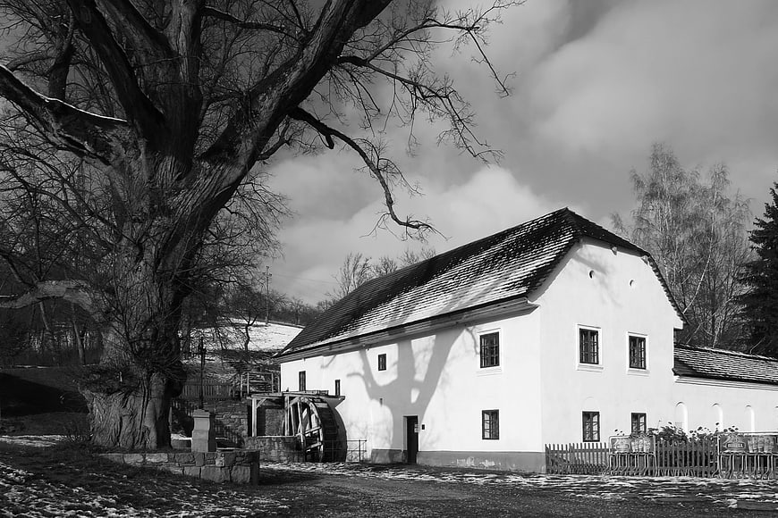 Black and white photo of historic Porcuv Mlyn watermill in Czech Republic