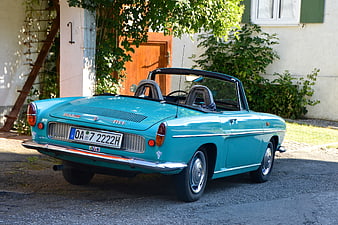 Vintage Teal BMW 700 Convertible Parked Outdoors