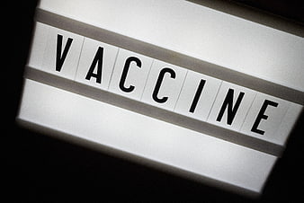 Vaccine Text on White Light Box Sign