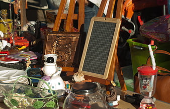 Vintage flea market table with eclectic antiques and trinkets