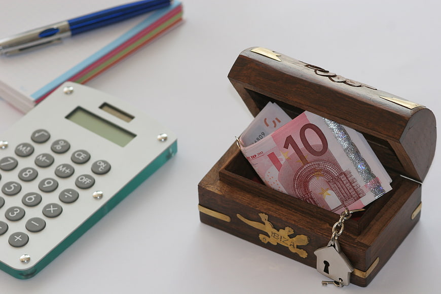 Wooden Money Box With Euro Banknotes And Calculator