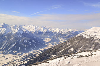 Panoramic View of Snow-Covered Alps and Winter Mountain Valley