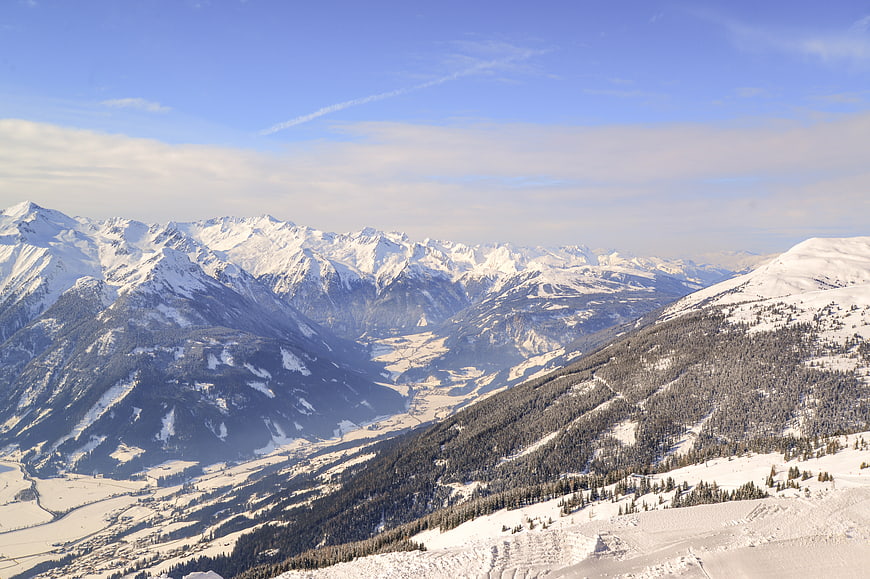 Panoramic View of Snow-Covered Alps and Winter Mountain Valley