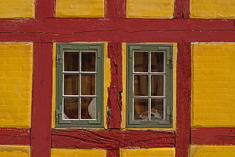 Colorful Half-Timbered House Facade with Green Windows