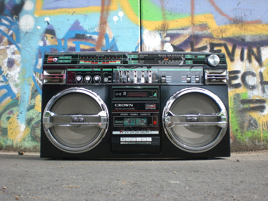 Vintage Crown Boombox Against Colorful Graffiti Wall