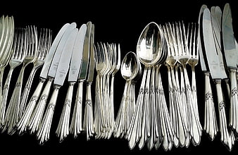 Set of Antique Silver Cutlery on Black Background