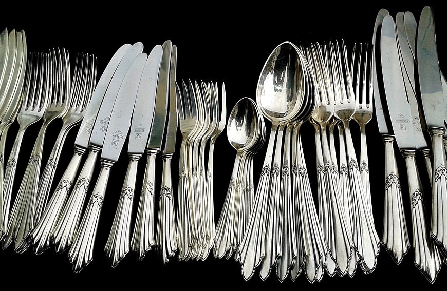 Set of Antique Silver Cutlery on Black Background