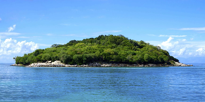 Lush Green Tropical Island in Blue Ocean